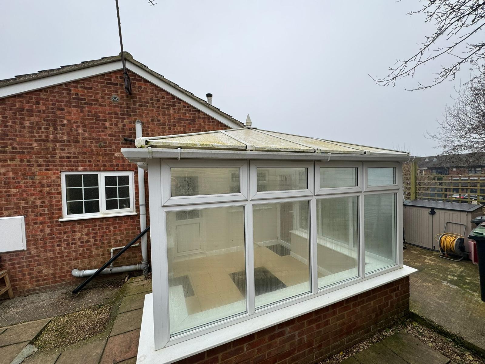 before - old polycarbonate conservatory roof